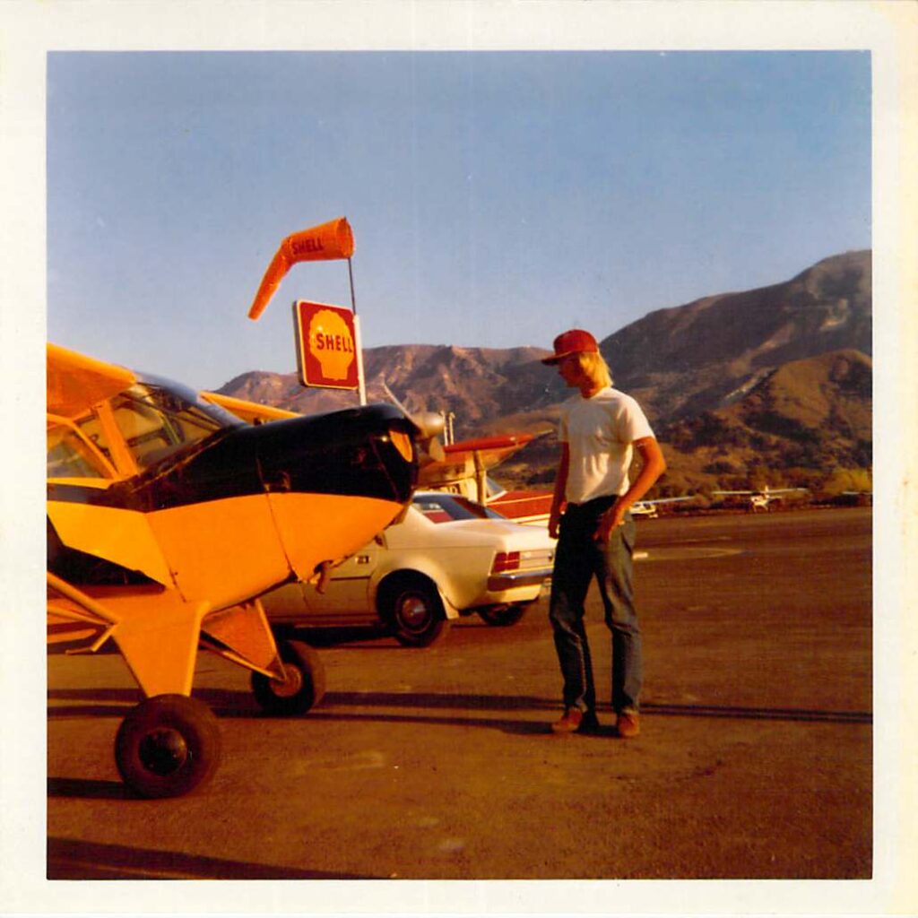 At one point during my sixteenth year, Mildred Wells pointed me toward an old Taylorcraft. I was able to buy it for $1400. Rex helped me clean it up, then gave me a tailwheel checkout in 45 minutes and 6 landings. I could fly it for $2 per hour in avgas. Much better than the $10 per hour it cost to rent the C150 pictured behind me.