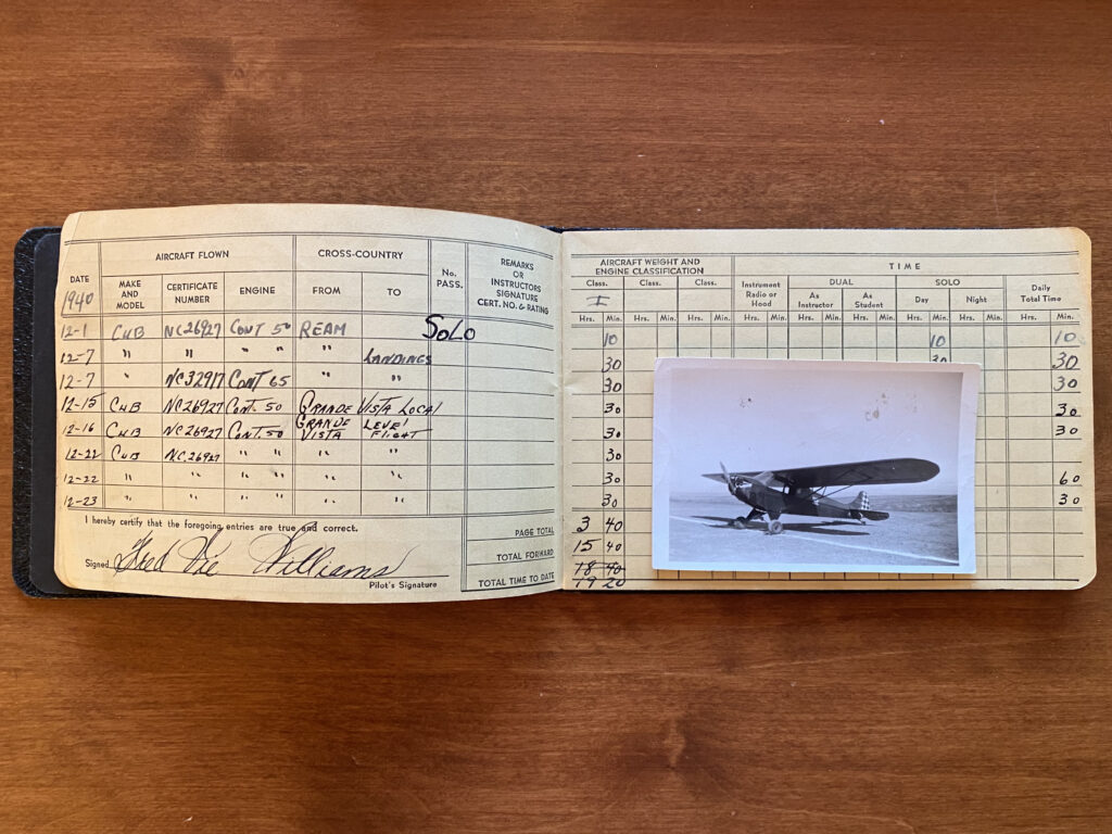 A page from my grandfather's logbook showing his first solo on December 1, 1940 along with an old photo of the airplane he did it in, a 50 horsepower Taylor Cub. He never earned his Private certificate as the war came along a year later and ended his flying for good.