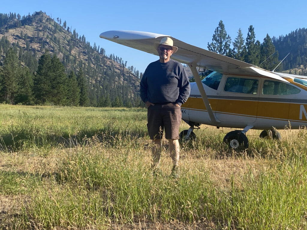Pete and his Cessna 182 at Reed Ranch. Airplanes, such as Pete's provide great access to nearly all of Idaho backcountry.